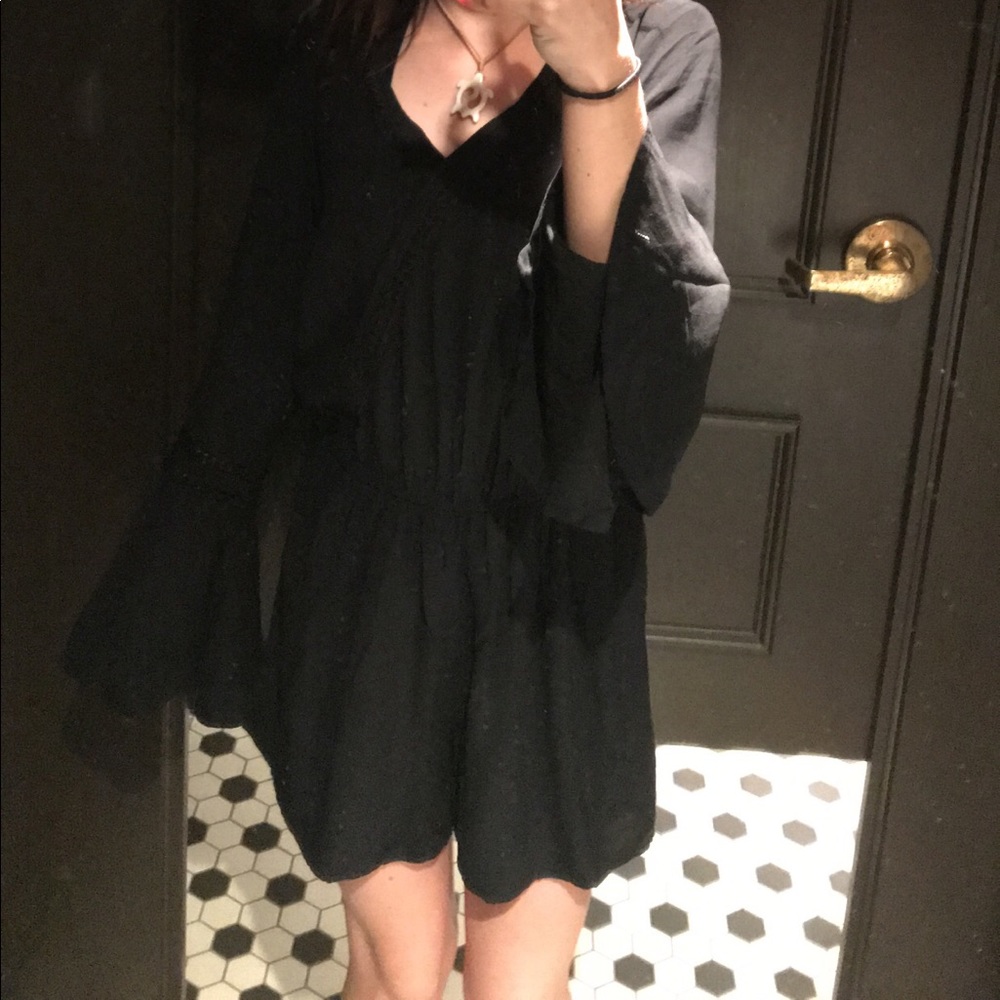 black romper lined with lace on edges